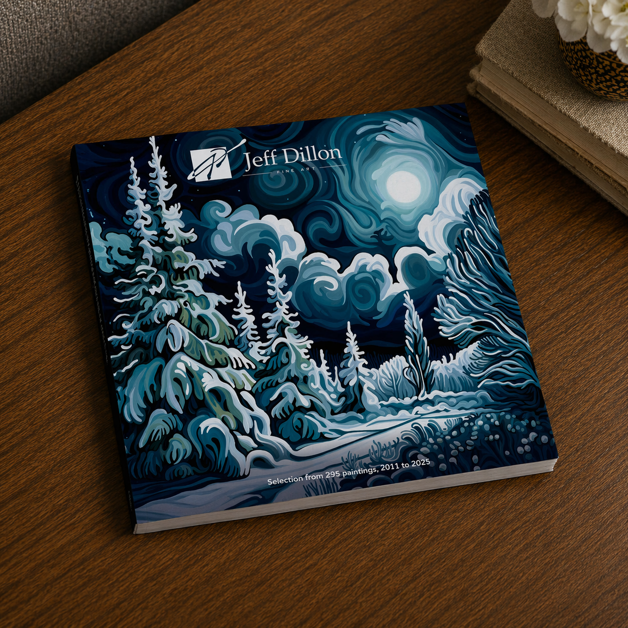 A book by Jeff Dillon features a winter night landscape painting on its cover.